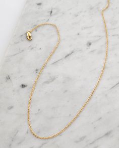 Our Dainty Cable Chain Necklace is a sparkling essential that effortlessly complements your everyday style. Its delicate design shines at every angle, making it perfect for solo wear or layering with our other necklaces for a chic, personalized look. MATERIAL 14k gold filled or .925 sterling silver Waterproof & hypoallergenic PRODUCT SPEC Chain width: 1mm OTHER 6 month warranty Comes in a jewelry pouch for longevity and easy gifting Empathy Cards, Word Bracelet, Layered Bracelets, Cable Chain, Jewelry Pouch, Jewelry Shop, Gold Filled, Charm Necklace, Everyday Fashion