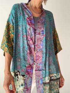 This is colourful upcycled silky shirt, made for both men and ladies with loose kimono sleeve  very light and comfortable over all, made oversized  perfect to wear on its own also layered over a sleeve blouse  very oryginal easy to wear unisex top  MEAESURE shoulder 27" pit to pit 27" length 30" MATERIAL *upcycled saree silk  more ideas at  https://www.etsy.com/shop/AltheaStores CARE INSTRUCTIONS  * Wash in warm water * Hand wash recommended * Hang to dry Thank You for looking Free Size Shirt, Free Spirit Fashion, Loose Kimono, Comfy Skirt, Boho Hippie Dress, Kimono Shirt, Silky Shirt, Hippy Style, Hippie Skirts