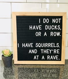 a sign that says i do not have ducks or a row i have squirrels and they're at a rave