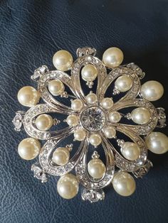 Approximately 3 inches.  See pictures for details.  This brooch is stunning and in excellent condition.  Stamped Nolan Miller on back.  d Formal Silver Pearl Brooch, Silver Pearl Brooch For Anniversary, Nolan Miller, Crystal Brooch, White Pearl, Faux Pearl, Brooch Pin, Brooches, Silver Tone