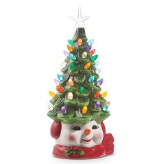 a ceramic christmas tree with two snowmen