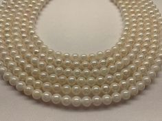 "Details We carry large section of akoya pearls collection on Etsy.com for wholesale price. 6.5-7.0 mm White Japanese Akoya Cultured Pearl, 16\", Cheap quality, would string to 18\" with knots clasp, Price per strand Good For wedding, graduation, anniversary. Pearl Information Lot111523-2 Surface markings and blemishesblemished/May have cracks on the pearls Shape                  Round Uniformity            Very-good Luster                  Lack-luster Minimum color  White  Size per pearl  6.5-7 Single Strand Pearl Necklace With Round Beads, Single Strand Round Pearl Necklace, Classic Round Pearl Necklace With Gemstone Beads, Hand-strung Round Pearl Necklace Gift, Classic Pearl Necklace With Gemstone Beads, High Luster Round Akoya Pearl Necklace, Hand-strung Pearl Necklace With Round Beads As A Gift, Formal Pearl Necklace With Round Gemstone Beads, Formal Round Gemstone Beaded Pearl Necklace