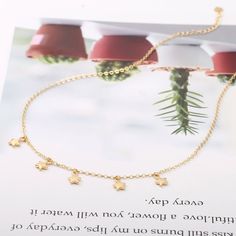 "Gold Star Choker Necklace,18K Gold Star Chain Choker Necklace,Dainty Star Celestial Charm Necklace,Dangle Star Layering Necklace,Minimalist Choker,Bridesmaid Necklace,Everyday Necklaces,Wedding Necklace,Best Friend Necklace This choker is a perfect understated, classic look with an edge. It makes a perfect gift for all ages. It is available in 16\", and an adjustable 15\" - 18\" lengths. Material:18K Gold Plated Color: Golden Length Size: 40cm chain and 5cm chain extension Star size:7mm Style: Dainty Star Charm Dangle Necklaces, Dainty Star-shaped Jewelry With Dangling Charms, Dainty Star Charm Dangle Necklace, Gold Star Charm Necklace With Clavicle Chain, Necklaces Wedding, Star Celestial, Everyday Necklaces, Star Choker, Best Friend Necklace