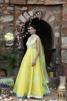 Featuring here Yellow, blue tie dye anarkali Set with mirror, bead,cutdana zari work paired with net choker dupatta. Fabric - Silk and net Components - 2 Colour - Yellow - blue Tie Dye Embroidery details - Hand Embroidery Delivery time - 2-3 weeks Washing Instructions - Dry-clean Maxi Length Chanderi Dupatta With Cutdana, Maxi Length Salwar Kameez With Gota Work In Chanderi, Maxi Length Chanderi Churidar With Dupatta, Floor-length Dresses With Gota Work For Transitional Season, Maxi Length Chanderi Salwar Kameez With Gota Work, Festival Anarkali Set With Gota Work In Maxi Length, Anarkali Set With Gota Work For Festivals, Designer Art Silk Anarkali Set With Mirror Work, Festive Dresses In Tissue Silk With Gota Work