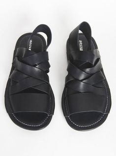 Black Casual Sandals With Woven Leather, Casual Open Heel Woven Leather Sandals, Black Open Toe Slingback Sandals With Woven Sole, Black Slingback Sandals With Rubber Sole For Beach, Black Slingback Sandals For Beach With Rubber Sole, Black Synthetic Sandals With Woven Leather, Black Woven Leather Sandals For Summer, Black Leather Sandals With Braided Straps, Black Sandals With Braided Straps For Spring