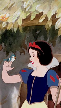 snow white holding a bird in her hand and looking at it's own reflection