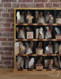 a shelf filled with lots of different types of bags and animals on top of it