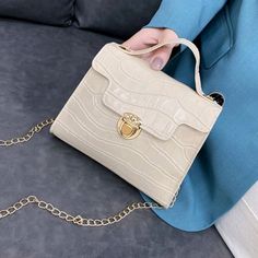 Beautiful Beige Color Cut Bag With Golden Chain. Puch Button Croc Embossed Flap Square Bag. 100% Polyurethane And 100% Polyester. Pu Leather Bag. Bag .. Length / 7.1. Bag Wide/ 1.6 Bag Lenght. / 5.9 Bag Stripe 46.5 Trendy Formal Bag With Snap Closure, Elegant Beige Shoulder Bag With Snap Closure, Trendy Clutch Bag With Snap Closure, Elegant Pouch Bag With Snap Closure, Calvin Klein Tote Bag, Orange Handbag, Marc Jacobs Purse, Fendi Shoulder Bag, Kate Spade Shoulder Bag