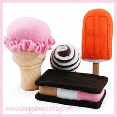 three ice cream cones, one in pink and one in brown