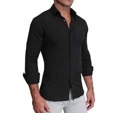 Our signature athletic fit dress shirt crafted from performance stretch fabrics. "The Von" solid black is an excellent business casual staple that makes a versatile addition to any dress shirt collection. Fit: More room in the upper body with a tapered waist Fabric Feel : Four-way stretch performance polyester / spandex fabric Fabric Function : Moisture-wicking, lightweight and wrinkle free Styling: Structured semi-spread collar and single button angled cuffs Additional Styling: Hidden under-the Black Dress Shirt With Spread Collar For Office, Black Dress Shirt For Office With Spread Collar, Modern Black Shirt For Semi-formal Occasions, Modern Black Semi-formal Shirt, Black Dress Shirt With Spread Collar For Business, Modern Black Dress Shirt For Business, Black Slim Fit Dress Shirt With Spread Collar, Black Slim Fit Dress Shirt For Semi-formal Occasions, Fitted Black Business Shirt