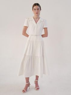 This is a trendy and feminine dress by BAU by Bride And You that is made out of high quality and sturdy material. With distinctive mood of the design and comfortable wear, you can style it for your casual daily outfit.- Tailored collar and torso line- Voluminous shirring on the skirt- Feminine and romantic mood Modern Spring Midi Shirt Dress, Modern Midi Shirt Dress For Spring, Elegant Collared Shirt Dress For Day Out, Feminine Short Sleeve Shirt Dress For Work, Modern Summer Shirt Dress For Work, Chic Collared Midi Dress For Day Out, Elegant Shirt Dress With Relaxed Fit And Spread Collar, Feminine Fitted Shirt Dress For Office, Chic Midi Dress With Collared Neckline For Day Out