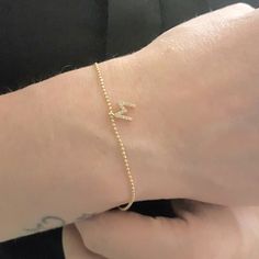 - Initial Bracelet for Women is made with high quality 14K real solid gold. - Initial Bracelet for women is with decorated white cubic zirconia stones. The length and width of the 14K gold initial letter is 6mm X 6mm. Its tickness is 2mm. -The bracelet length is 6.9 inches. Also there is a 1.18 inches 14K gold extender. The tip of the extender is decorated with a round white zircon stone. So you can arrange its length. - Its closure is 14K gold lobster claw style. Its chain is special. The ball Adjustable 14k Gold Birthday Bracelets, Adjustable 14k Gold Bracelets For Birthday, Adjustable 14k Gold Bracelet For Birthdays, Yellow Gold Bracelets With Initials For Anniversary, Elegant Yellow Gold Bracelets For Birthday, Elegant Yellow Gold Birthday Bracelets, Adjustable Yellow Gold Name Bracelet As Birthday Gift, Adjustable Yellow Gold Name Bracelet For Birthday Gift, Elegant Initials Bracelets For Birthday