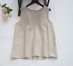 " -Material: 100%Linen -Washing in cold water -Sleeveless In order to make it more suitable for you, please tell me your body measurements. -your height -your weight -your bust circumference -your upper Arm circumference -Phone number for shipping TOPS  XS: Bust:88cm/34.5\" length: 60cm/23.5\" S: Bust:92cm/36\" length: 60cm/23.5\" M: Bust:96cm/38\" length: 60cm/23.5\" L: Bust:102cm/40\" length: 60cm/23.5\" XL: Bust:108cm/42.5\" length: 60cm/23.5\" XXL: Bust:116cm/45.5\" length: 60cm/23.5\" 3XL: Beige Crew Neck Vest For Summer, Beige Crew Neck Tank Top For Summer, Sleeveless Beige Cotton Blouse, Beige Sleeveless Cotton Blouse, Womens Blouses Summer, Linen Vest, Blouse Summer, Summer Vest, Vest Tops