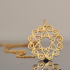 "14k gold necklace, solid gold chain and pendant. This beautiful Mandela necklace will be a perfect gift for Christmas. You can call this fine jewelry pendant a sun, you can call this necklace a flower, mandala, or even hidden Magen-David.... That is what so special in this 14 k gold necklace - the little many details join together to interesting form that inspire the imagination. The pendant is 14k yellow solid gold with 14k gold chain The mandala: * 14k solid gold * Pendant width 2.2 c\"m (0.8 Gold Bohemian Necklace For Anniversary, Bohemian Gold Necklace For Anniversary, Handmade Elegant Star Of David Jewelry, Gold Chain And Pendant, Gold Filigree Necklace, Mandala Ring, Love Mandala, Necklace Gold Pendant, Mandala Jewelry