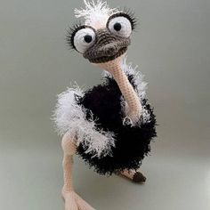 an ostrich is wearing a black and white dress