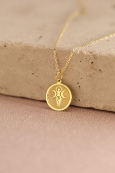 Gold Gaia Pendant - Gaia Gold Necklace ● Material of pendant: Solid Gold 14k ( REAL GOLD ) ● Metal Stamp: 14k ( REAL GOLD ) ● The pendant is available in 5 sizes: - 12,7 mm / 0.5 inches (Diameter) - 14,0 mm / 0,55 inches ( Diameter ) In the photos - 15,3 mm / 0.6 inches ( Diameter ) - 16,5 mm / 0,65 inches ( Diameter ) - 19,1 mm / 0,75 inches ( Diameter ) ( In the photos the size is 14mm / 0.55 inches Diameter ) ( Jump Ring inner diameter: 4 mm ) ● Material of chain: Solid gold 14k ( REAL GOLD ) Gold Engraved Goddess Jewelry, Gold Engraved Goddess Style Jewelry, Gold Goddess-style Engraved Jewelry, Gold Goddess Style Engraved Jewelry, Gold Engraved Goddess Necklaces, Gold Engraved Goddess Style Necklaces, Gold Engraved Goddess Necklace, Gold Goddess Style Engraved Necklace, Yellow Gold Goddess Necklace For Gift