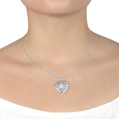 Add this Sparkle Allure pure silver over brass 18 inch heart locket necklace to your jewelry collection for a simple and trendy look. This locket necklace is crafted in pure silver over brass, features a beautiful sparkling Cubic Zirconia stone and can be opened to add small memorable pieces. The chain is 18 inches in length with a 2 inch extender, a solid link construction and a spring ring clasp for a safe and comfortable wear. You can stack this locket necklace with your other favorite neckla Heart Locket Necklace, Heart Locket, Locket Necklace, Pure Silver, Spring Rings, Locket, Diamond Necklace, Cubic Zirconia, Jewelry Collection