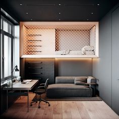 a room with a couch, desk and shelves on the wall next to a window