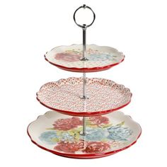 three tiered tray with flowers painted on the bottom and metal handles, each holding two plates