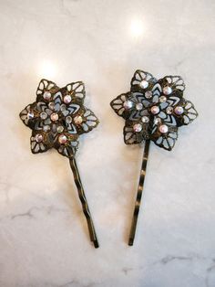 Antique bronze hair pin with swarovski crystals (set of two)
Pretty antique bronze colored flower bobby pins with swarovski crystals. Comes
in a set of two.

The flower is about 1 1/2 inches wide. Flower Bobby Pins, Bronze Hair, Banana For Hair, Vintage Wedding Hair, Rhinestone Hair Pin, Bride Hair Accessories, Wedding Hair Pins, Bridal Hair Pins, Crystal Wedding