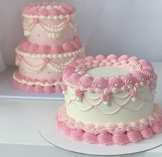 three tiered pink and white wedding cakes