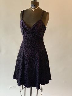 Vintage 1980s purple and black metallic formal skater dress flared short skirt with straps and sweetheart neckline.Measurements:Bust: 34"Waist: 29"Hips: openArmpit to hem: 28 1/2"