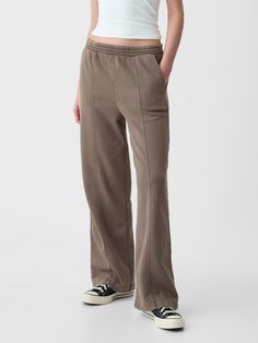 Soft fleece knit wide-leg sweatpants.  Elasticized waist.  Front slant pockets.  Seam at front.  Mid rise.  Straight silhouette with a relaxed fit.  Wide leg.  Models wearing Gap Everyday Wide Leg Sweatpants For Fall, Casual Soft Bottoms For Everyday, Soft Casual Bottoms For Everyday, Soft Casual Everyday Bottoms, Gap Full Length Relaxed Fit Pants, Gap Relaxed Fit Full Length Pants, Soft-washed Wide Leg Loungewear Pants, Gap Relaxed Fit Full-length Pants, Gap Washed Cotton Bottoms