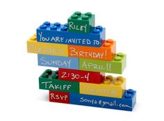 lego blocks are stacked up with the names of each child's birthday party guests