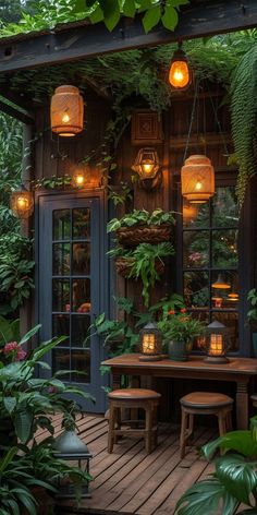 an outdoor dining area with plants and lanterns