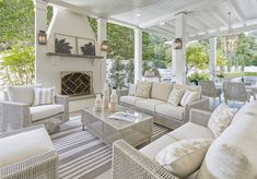 a living room filled with furniture and a fire place