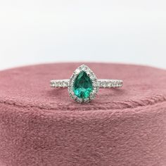 This gorgeous ring features a 0.60-carat pear-shaped emerald gemstone with earth-mined diamonds, all set in solid 14K gold. This ring can be a beautiful May birthstone gift for your loved ones! This ring is made with solid 14K Gold and naturally Earth-mined SI / G-H diamonds. As listed, this ring is ready to ship. If you're interested in purchasing this setting with a different center stone please message us! Green Pear-shaped Diamond Ring, Green Brilliant Cut Pear-shaped Diamond Ring, Green Pear-shaped Diamond Ring With Brilliant Cut, Green Pear-shaped Brilliant Cut Diamond Ring, Green Teardrop Emerald Ring With Brilliant Cut, Diamond Teardrop Emerald Ring For Promise, Teardrop Diamond Emerald Ring For Promise, Teardrop Emerald Ring With Brilliant Cut, Pear-shaped Green Diamond Ring With Center Stone