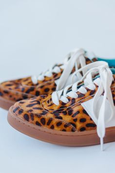 Step into sass with Matisse's Quincy sneaker in a fierce tan leopard print. These kicks will elevate any outfit and add a playful touch to your shoe collection. Walk on the wild side comfortably with the perfect combination of style and comfort. Leopard Print Leather Sporty Sneakers, Leopard Print High-top Sneakers For Streetwear, High-top Leopard Print Sneakers For Streetwear, Sporty Leopard Print Sneakers For Streetwear, Leopard Print Leather Sneakers With Branded Insole, Leopard Print High-top Leather Sneakers, Leopard Print Lace-up Sneakers For Streetwear, Leopard Print Sneakers With Rubber Sole, Leopard Print Sneakers With Round Toe And Rubber Sole