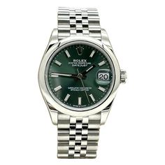 Style Number: 278240 Serial: H68Q5*** Year: 2020 - Now Model: Midsize Datejust Case Material: Stainless Steel Band: Stainless Steel Bezel: Stainless Steel Smooth Bezel Dial: Green Face: Sapphire Crystal Case Size: 31mm Includes: -Rolex Box -Certified Appraisal -1 Year Warranty SKU 20717 / 120730TSTADEN121323 Watch With Green Face, Green Formal Watch With Date Display, Formal Green Watch With Date Display, Stainless Steel Band, Rolex, Wrist Watch, Jewelry Watches, Sapphire, Stainless Steel