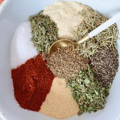 spices and seasonings in a bowl with a spoon