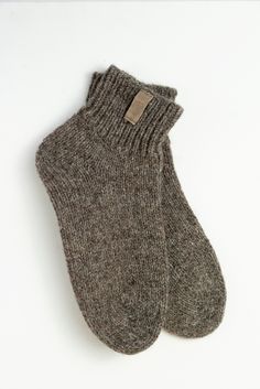 These natural wool socks are handmade following Scandinavian design. They will warm you or your beloved ones during the coldest winter months. Warm woolen socks are also a great gift idea. The socks are made from cruelty-free sheep and dog wool. Dogs are combed, and their hair is mixed with sheep wool to get the perfect combination. Researchers have found that man benefits from dog wool, which has healing properties. It relieves a wide range of pain, especially radiculitis. Knits made of dog woo Cozy Brown Socks For Stocking Stuffers, Cozy Warm Brown Socks, Woolen Socks, Hygge Gifts, Style Socks, Woolen Sweaters, Christmas Gift Idea, Wool Socks, Casual Socks