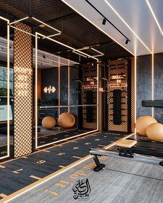 an exercise room with mirrors, treadmills and yoga balls on the floor in front of it