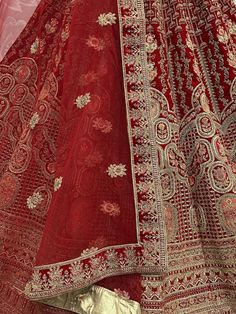 <ul>
<li style="text-align: justify;"><span data-preserver-spaces="true">The bride and her bridal lehenga choli are the center of attraction and deserve to be the star of the event this rich look red velvet multi thread embroidered the diamond embellished lehenga is one of the great choices for it.</span></li>
<li style="text-align: justify;"><span data-preserver-spaces="true">This rich bridal lehenga paired up in red velvet color choli in heavy embroide Red Gown With Pallu For Navratri, Red Gown With Pallu For Traditional Ceremonies, Red Floor-length Sets With Zari Work, Red Bollywood Anarkali Set With Motifs, Red Gown With Pallu In Traditional Drape, Traditional Red Semi-stitched Gown, Red Gown With Intricate Embroidery And Traditional Drape, Red Anarkali Dress With Motifs, Red Sets With Zari Work For Traditional Ceremonies