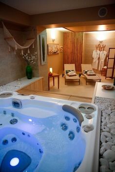 a large jacuzzi tub sitting inside of a bathroom