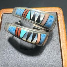 Condition: Pre-Owned / Good Condition Earring Style: Huggie Hoops Design: Native American Zuni Inlay Design Jewelry Metal: Sterling Silver Gemstone Inlay: Spiny Oyster, Coral, Sodalite, Mother Of Pearl & Jet Maker: Zuni Artist From Bg Mudd Markings: .925 Medicine Wheel Mark (Bg Mudd Makers Mark) Inlay Design, Medicine Wheel, Jewelry Metal, Spiny Oyster, Design Jewelry, Huggie Hoop Earrings, Metal Jewelry, Makers Mark, Blue And Silver