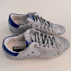 Super Cute Golden Goose Silver Glitter Sneaker // Rare Silver Glitter With Grey And Royal Blue Accents. Brand New In Box With Dustbag And Original Packaging. All Items From My Personal Closet And Guaranteed Authentic. Cute Golden Goose, Golden Goose Silver, Golden Goose Superstar, Personal Closet, Hightop Sneakers, Glitter Sneakers, Golden Goose Sneakers, Golden Goose Shoes, Glitter Shoes