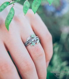 Such a unique silver ring can be created while the designer is still in the forest, watching the leaves fluttering on the branch. And an elegant branch with leaves, studded with emeralds, is created. It is as alive and swirls on her finger. It is an original gift for someone who loves Nature. Nature-inspired Emerald Ring, Branch With Leaves, Leaves Ring, Ring With Emerald, Unique Silver Rings, Twig Ring, Branch Ring, Local Jewelry, Leaf Ring