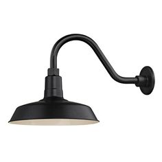 a black wall light with an arm and white shade on the side, against a white background