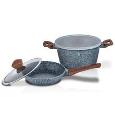 two pots and pans with wooden handles