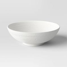 a white bowl sitting on top of a table