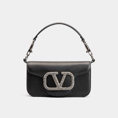 Valentino "Loco" shoulder bag in lambskin leather Features embellished VLOGO accent  Detachable flat top handle  Detachable, sliding chain shoulder strap Flap top with magnetic closure  Interior, one slip pocket Approx. 4.3"H x 7.9"W x 2"D Made in Italy Jewel Logo, Compartment Bag, Valentino Bag, Combination Fashion, Purple Bag, Crystal Bags, Valentino Bags, Small Shoulder Bag, Cute Bags