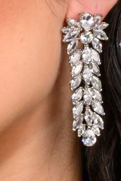 Crystal jewels come to life in the gorgeous design. Our HELENA earrings are long and filled with beauty to complete your entire look. The perfect amount of glamour and high style to add to any special occasion attire. Handcrafted Highest Quality Swarovski / Cubic Zirconia Platinum plated Guards against scratches and tarnish. approximate size 2.5" length 1" width Nickel free Free Shipping in USA Glamorous Crystal Embellished Earrings For Formal Occasions, Glamorous Crystal Embellished Formal Earrings, Silver Bridal Earrings For Glamorous Events, Cubic Zirconia Cluster Dangle Earrings For Party, Luxury Crystal Embellished Earrings For Party, Luxury Sparkling Stones Chandelier Earrings For Party, Glamorous Drop Bridal Earrings For Events, Luxury Sparkling Chandelier Earrings For Party, Luxury Party Chandelier Earrings With Sparkling Stones