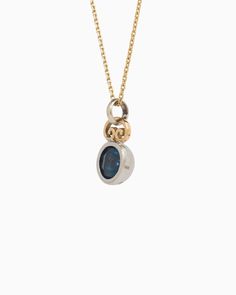 The Blue Moon Pendant combines simplicity with distinctive elegance. It showcases a delicate design, featuring a faceted London blue topaz stone set in sterling silver, complemented by a 14K gold petroglyph detail at the top. Pair with your favorite chain, sold separately. Metal: Sterling silver with 14K gold accent Stone: London blue topaz Dimensions: 18mm x 10mm Style #: P113Lb Gold Topaz Jewelry With Rose Cut Diamonds, Yellow Gold Topaz Jewelry With Bezel Setting, Fine Jewelry Topaz With Bezel Setting, Luxury Topaz Jewelry With Polished Finish, Yellow Gold Jewelry With Round Blue Topaz, Luxury Polished Topaz Jewelry, Timeless Sapphire Jewelry In Yellow Gold, Elegant 14k Gold Polished Gemstones, Timeless Yellow Gold Sapphire Jewelry