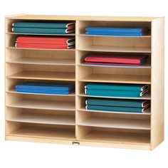 a wooden shelf filled with files and folders