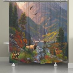 a shower curtain with an image of deer in the mountains