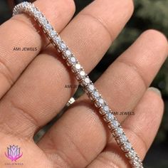 ⭐️ About Product : → Average Length : 7.00 Inch → Average Link: 56 → Closer : Box Clamp With Hinged Safety Lock → Chain Style : Tennis → Setting : Prong ( 4-prong ) ⭐️ Diamonds Details: → Diamonds Carat : 5.00 CTW → Diamonds No : 56 → Diamonds Color : G/H → Diamonds Clarity : VVS → Diamonds Cut : EXCELLENT  → Diamonds Shape : Round  → Diamonds Type : Lab Grown / Moissanite → All detail mentioned for 7.00 inch, its may vary by length. ⭐️ Customization: → Customization available on request. Message us for any customization request. (Metal Purity, Size, Length, Diamond, Etc.) → If you don't find a perfect Jewelry in the store, just message us with the inspiration image and get a free quote and customization in easy steps → We send CAD ( mockup ) for approval before making the jewelry → Free E White Sterling Silver Tennis Bracelet For Anniversary, Classic Moissanite Diamond Bracelet As Gift, Wedding Diamond Bracelet In Sterling Silver With Vvs Clarity, Wedding Diamond Bracelet In Sterling Silver, Sterling Silver Tennis Bracelet With Vvs Clarity For Anniversary, Vvs Clarity Sterling Silver Tennis Bracelet For Anniversary, Classic Moissanite Tennis Bracelet For Anniversary, White Diamond Bracelet With Single Cut Diamonds, Dazzling Diamond Bracelet As Gift